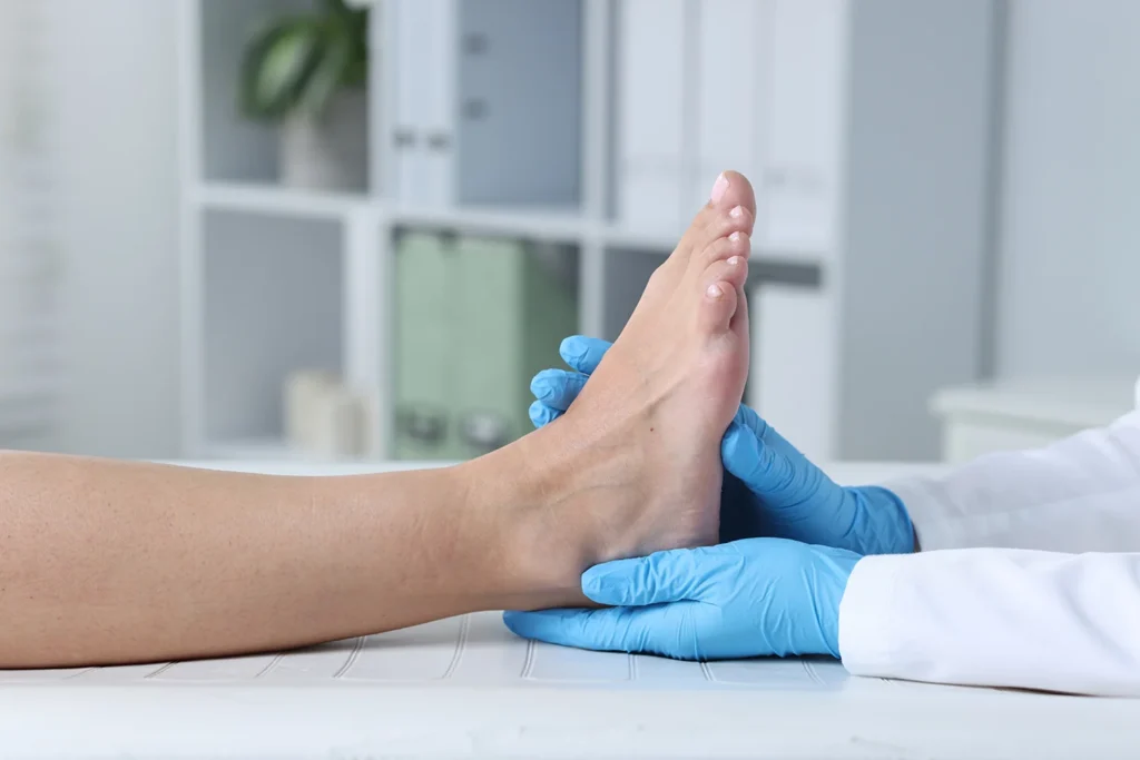 doctor examining patients foot