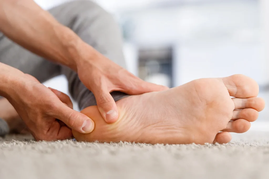 man ands giving foot massage