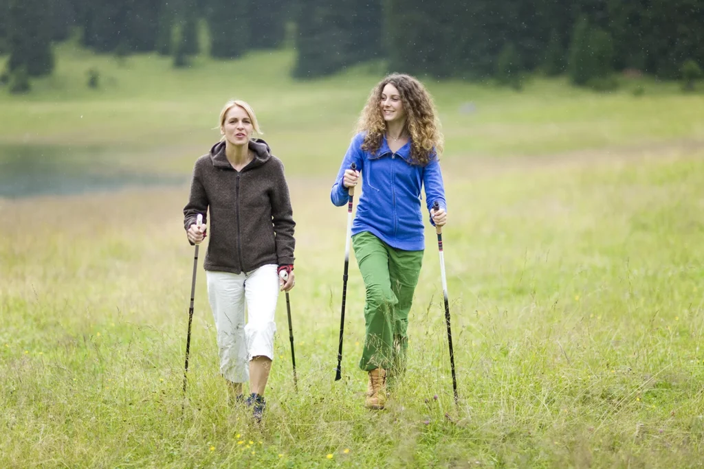 mother hiking with teenage daughte